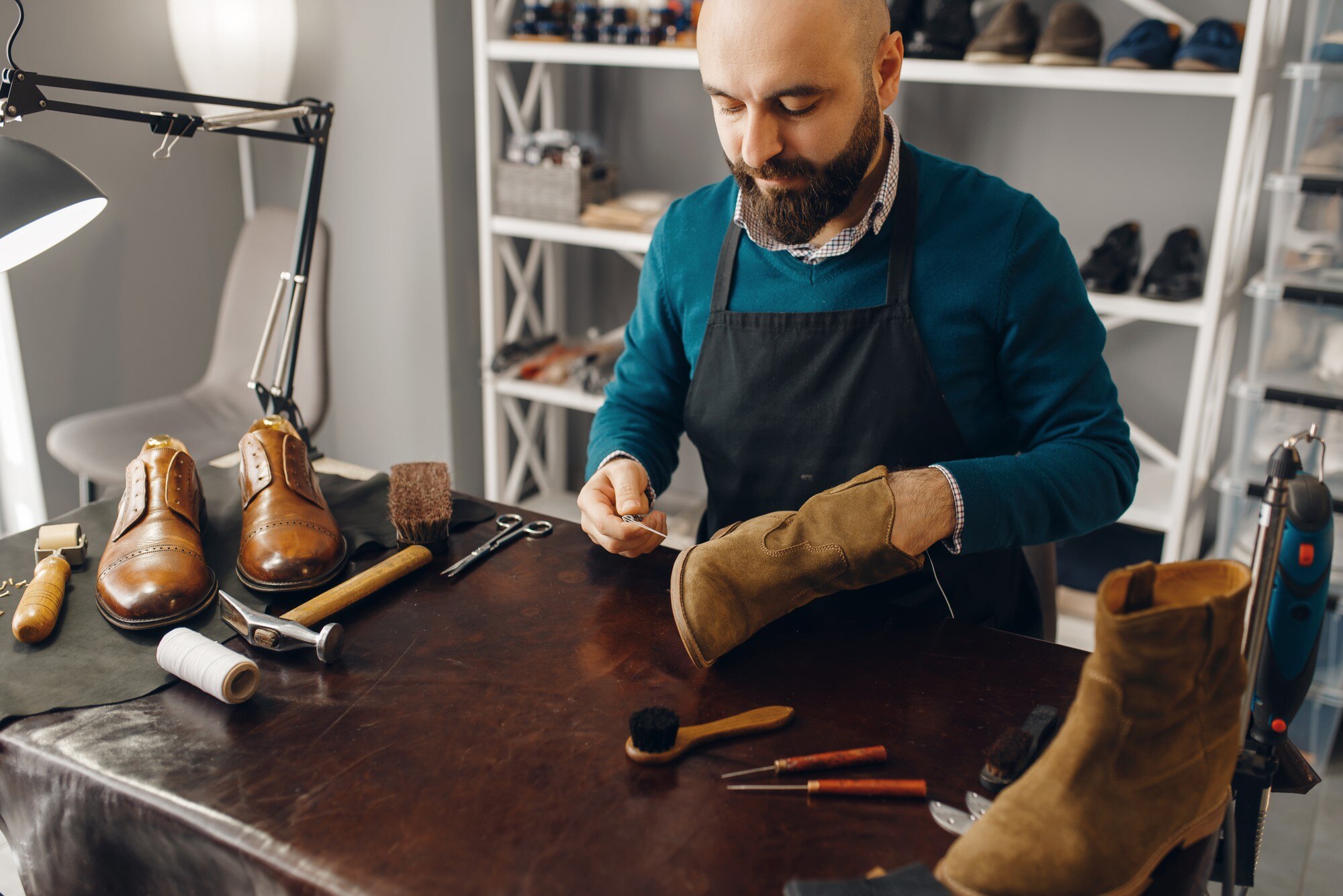 shoemaker-stitches-shoe-footwear-repair-service-266732-24635.jpg
